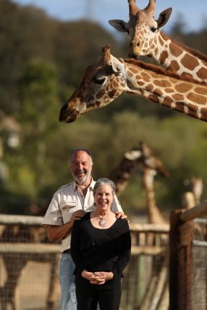 Nancy and Peter Lang with giraffes at Safari West