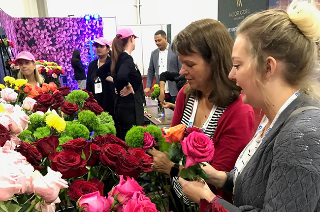 IMEX America Attendees Working on Bouquets at the Repeat Roses Booth