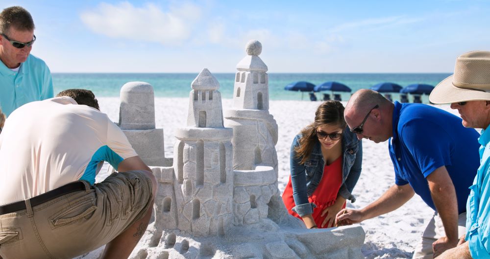 Group building a sand castle