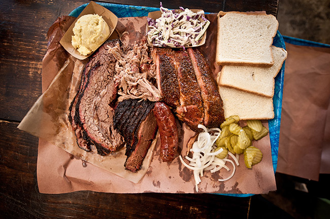 Barbecue Spread With Sides, Franklin Barbecue, Credit: Eric Ellis