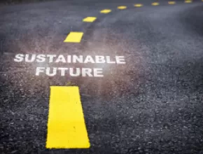 Road with Sustainable Future text overlay