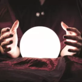 Image of fortune teller and crystal ball.